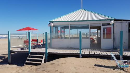 a building on a dock on the beach at MitreCity in Ostende