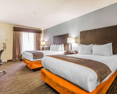 a hotel room with two beds and a large window at Quality Inn Mt Pleasant - Charleston in Charleston