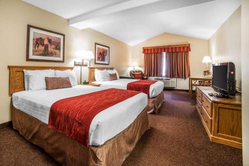 Un pat sau paturi într-o cameră la K Bar S Lodge, Ascend Hotel Collection