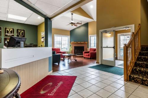 a living room with a kitchen and a living room with a fireplace at Econo Lodge Inn & Suites Dickson in Dickson