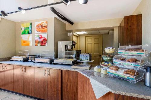 a kitchen with a counter with some food on it at Quality Inn & Suites Sevierville - Pigeon Forge in Sevierville
