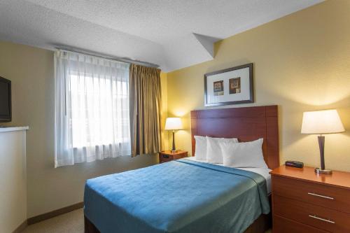 a hotel room with a bed and a window at MainStay Suites Brentwood-Nashville in Brentwood