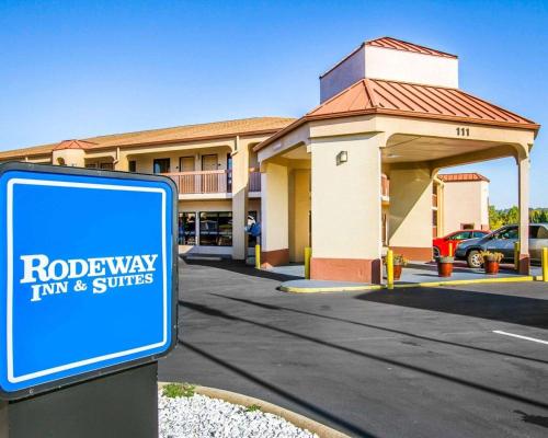 a blue sign in front of a building at Rodeway Inn & Suites in Clarksville