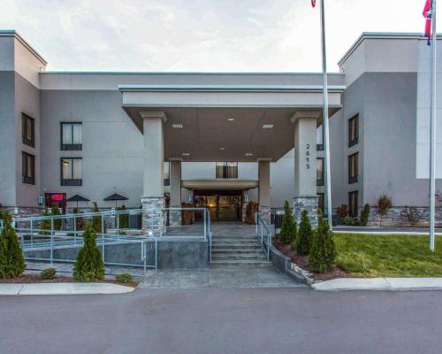 a building with stairs leading to the front entrance at Quality Suites Nashville Airport in Nashville