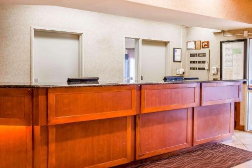 a lobby with a reception desk with a mirror at Quality Inn & Suites Germantown North in Memphis