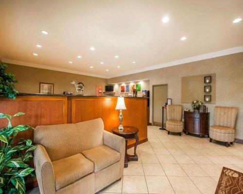 a living room with a couch and a table at Quality Inn & Suites Germantown North in Memphis