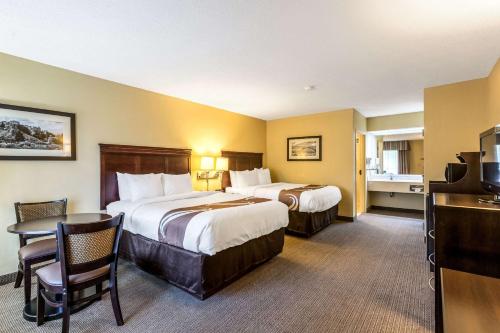 a hotel room with two beds and a table at Quality Inn Union City US 51 in Union City