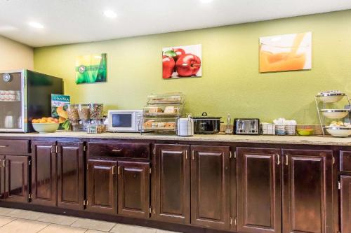 a kitchen with a counter with microwaves on it at Quality Inn & Suites in La Vergne