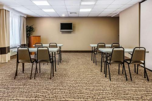 a conference room with tables and chairs and a tv at Comfort Inn & Suites Airport-American Way in Memphis