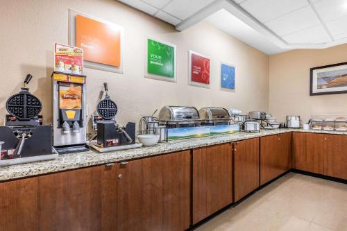 a kitchen with a counter with some food on it at Comfort Inn & Suites Airport-American Way in Memphis