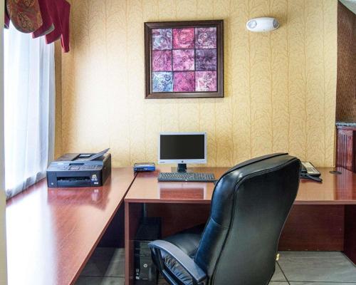 an office with a desk with a computer and a chair at Quality Inn Midland South in Midland