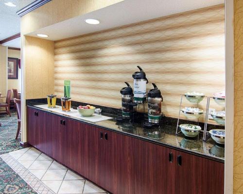 a kitchen with a counter with drinks on it at Quality Inn Midland South in Midland