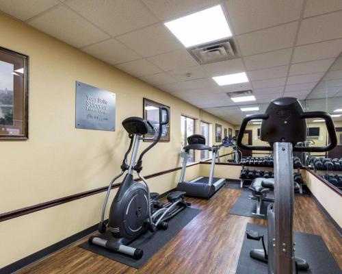a gym with several treadmills and exercise bikes at Comfort Suites Lake Jackson Clute in Lake Jackson