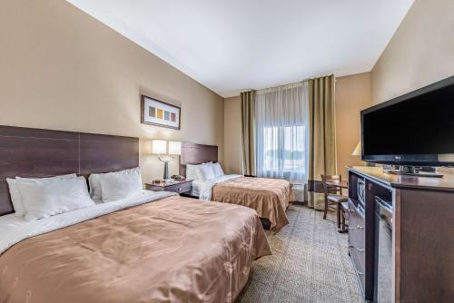 Ένα ή περισσότερα κρεβάτια σε δωμάτιο στο Quality Inn West Plano - Dallas