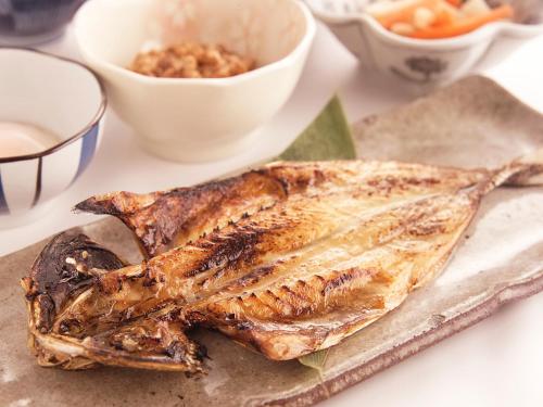 a piece of fish sitting on top of a table at Daiichi Inn Park in Sendai