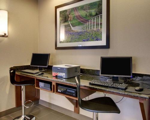 an office with a desk with a computer and a printer at Comfort Suites Tyler South in Tyler