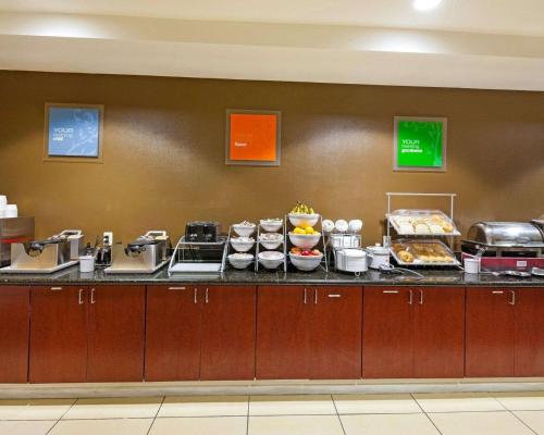 a buffet line in a hotel room with food at Comfort Suites University in Abilene