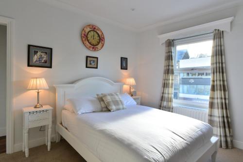 Кровать или кровати в номере The Inn at Cheltenham Parade
