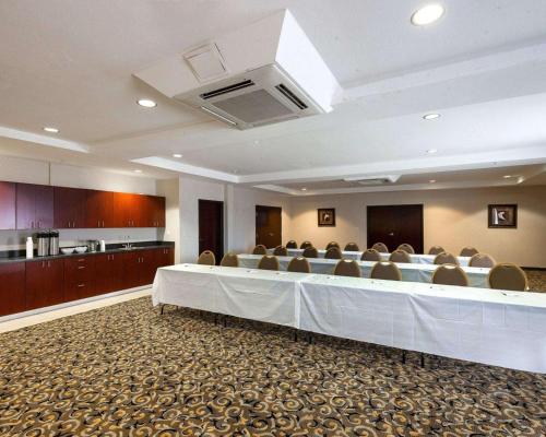 a large meeting room with a long table and chairs at Comfort Suites University in Abilene