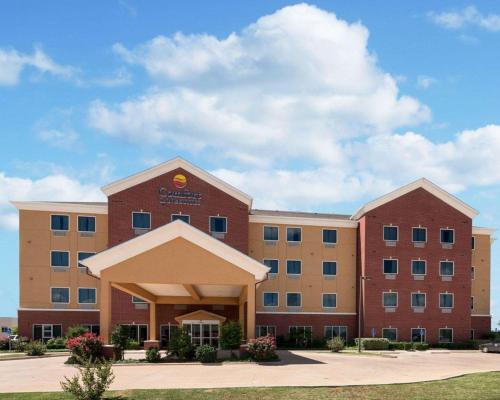 a large brick building with a building at Comfort Inn & Suites Regional Medical Center in Abilene