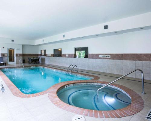 a large swimming pool in a hotel room at Sleep Inn and Suites Round Rock - Austin North in Round Rock