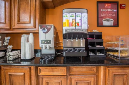 a kitchen counter with a mixer on a counter top at Quality Inn & Suites Bridge City Orange in Bridge City