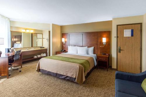 a hotel room with a large bed and a desk at Comfort Inn Wichita Falls North in Wichita Falls