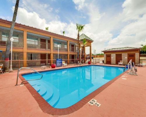 a large swimming pool in front of a building at Econo Lodge Inn & Suites in Eagle Pass