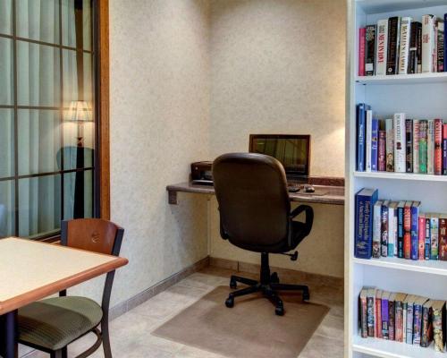 an office with a chair and a desk with books at Quality Inn & Suites Glen Rose in Glen Rose
