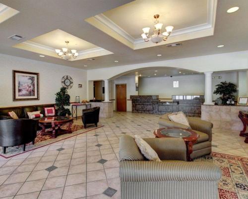 a lobby with couches and a table in a hotel at Quality Inn & Suites Glen Rose in Glen Rose