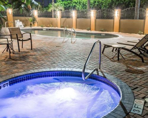 a hot tub in a patio with chairs and a table at Comfort Inn & Suites Pharr - McAllen in Pharr