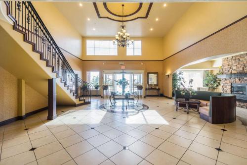 a large lobby with a staircase and a living room at Comfort Inn & Suites in Cedar City