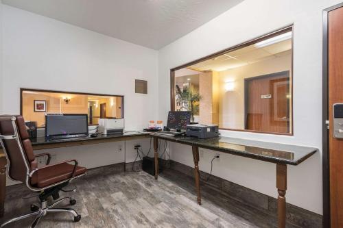 an office with a desk with a computer and a chair at Comfort Inn & Suites in Cedar City