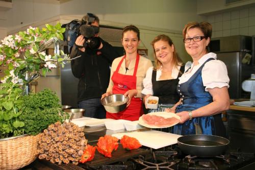 a group of three women standing in a kitchen at Mohnhotel - Bergwirt Schrammel in Zwettl Stadt