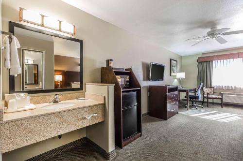 a bathroom with a sink and a large mirror at Quality Inn Washington - St George North in Washington