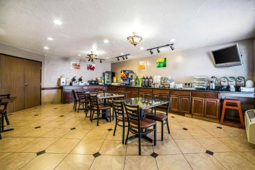 a restaurant with tables and chairs and a counter at Quality Inn Zion Park Area in Hurricane