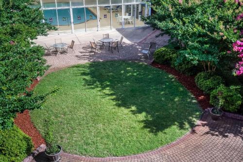 an overhead view of a garden with tables and chairs at Sleep Inn Lake Wright - Norfolk Airport in Norfolk
