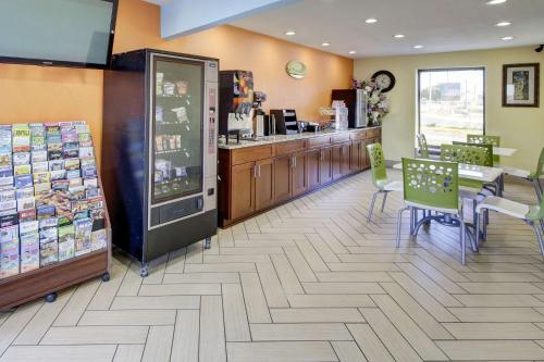 a store with a counter and chairs in a store at Econo Lodge at Military Circle in Norfolk