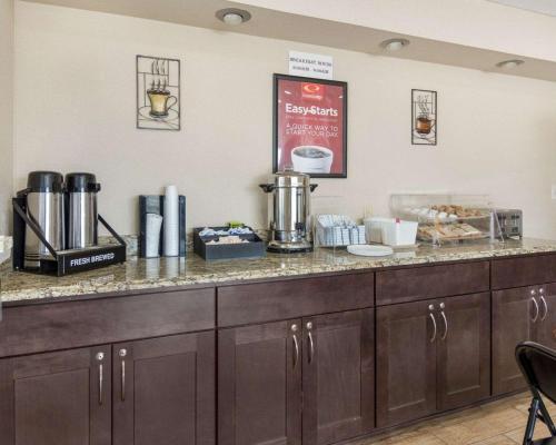 a kitchen with a counter top with a coffee maker at Econo Lodge Virginia Beach Town Center in Virginia Beach