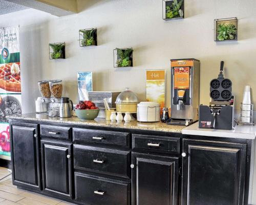 a kitchen with a counter with a coffee maker at Quality Inn Thornburg in Thornburg
