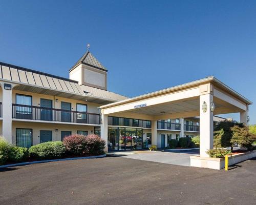 a large building with a clock tower on top of it at Quality Inn Troutville - Roanoke North in Troutville