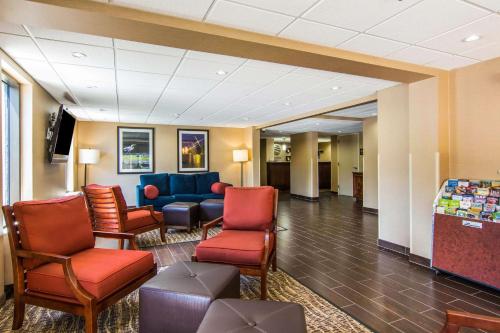 a waiting room in a hospital with chairs and tables at Quality Inn in Newport News