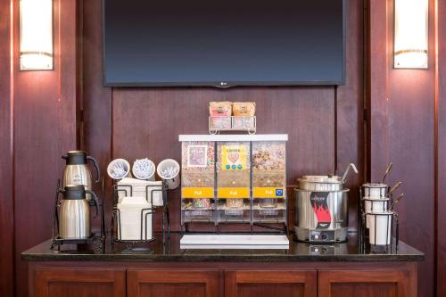 a counter with a coffee maker on top of it at Comfort Inn & Suites Near Burke Mountain in Saint Johnsbury