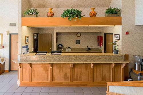 a kitchen with a counter top with a sink at Econo Lodge in Buckley