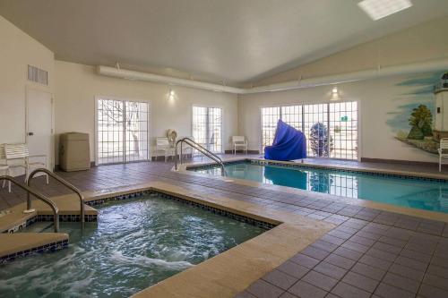 a pool in a large room with a swimming pool at Comfort Inn Fond Du Lac in Fond du Lac
