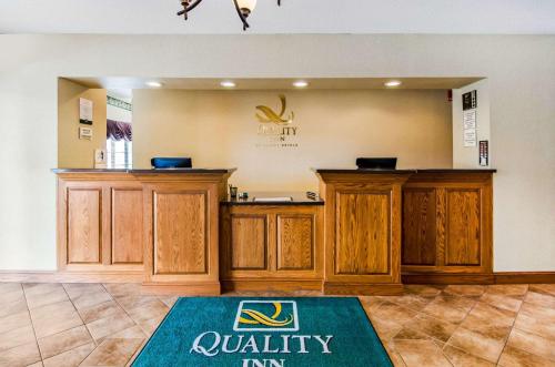 a gym with wooden cabinets and a mat on the floor at Quality Inn Summersville - New River Area in Summersville