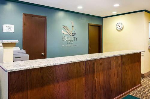 a lobby with a pharmacy sign on the wall at Quality Inn in Princeton