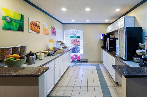 a fast food restaurant with a large kitchen with counters at Quality Inn in Princeton