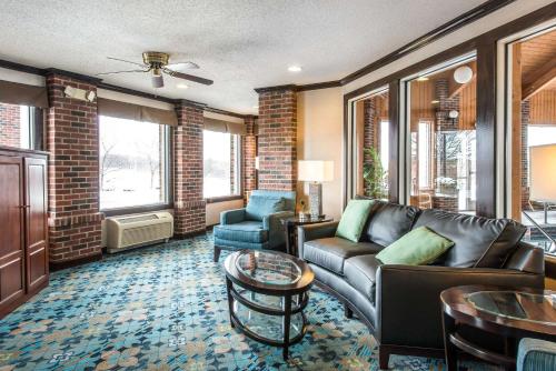 a living room with a couch and a table at Comfort Inn in Weirton