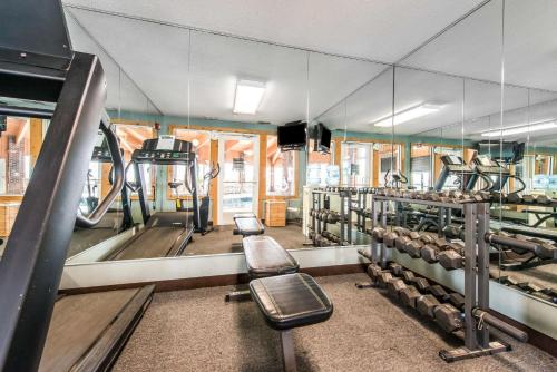 a gym with a bunch of machines in it at Comfort Inn in Weirton